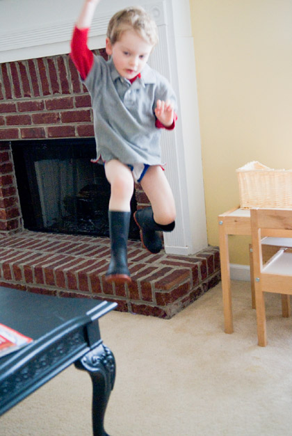 In midair, leaping through the sky, fighting bad guys In midair, leaping through the sky, fighting bad guys