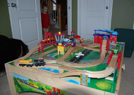 Will, admiring his new train tracks (and, yes, he is missing pants) Will, admiring his new train tracks (and, yes, he is missing pants)